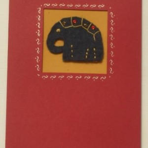 Handmade greeting card with embroidered blue felt elephant